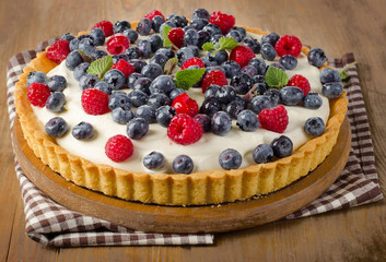 Cake with  raspberries and blueberries.