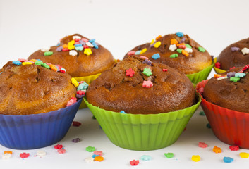 muffins decorated with colored powder