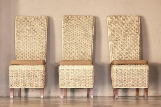 Three thatch chairs