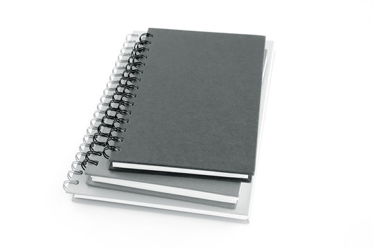 Stack of notebooks or copybooks on white background