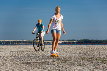 Mother and daughter do morning outdoor fitness