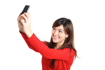 Naklejka premium Asian girl taking a selfie with her phone