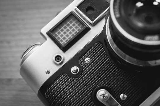 Black and white macro of retro camera viewfinder and lens