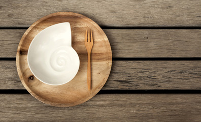 Wooden plate with space on wood floor