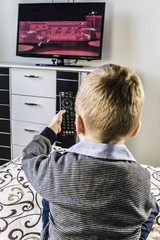 child watches TV, remote control TV