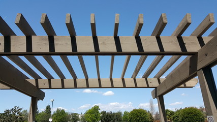Portland wooden backyard pergola against blue sky