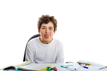 Acne Caucasian Teenager makes tongue grimacing on homework