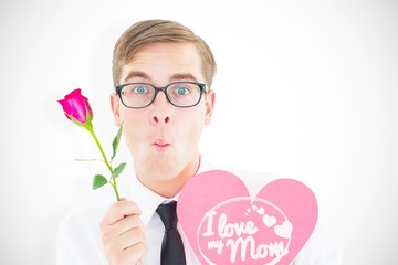 geeky hipster holding a red rose and heart card