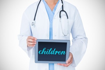 Children against doctor showing tablet pc