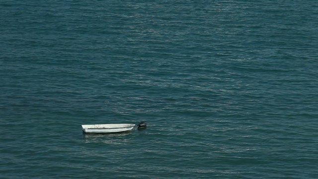Old fishing boat floating on sea