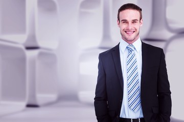 smiling elegant businessman with hands in pocket