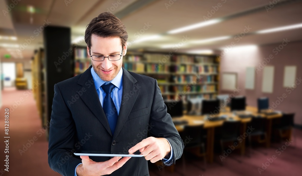 Poster Composite image of businessman standing while using a tablet pc