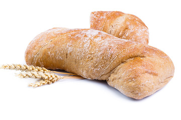 Bread with wheat on a white background.