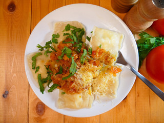 Ravioli with tomato sauce top view