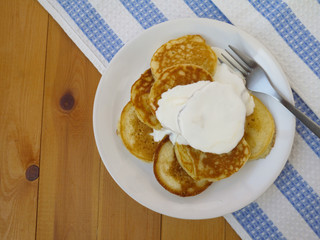 Pancakes with sour cream top view