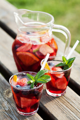 Refreshing sangria (punch) with fruits, picnic idea