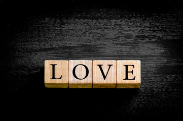 Word LOVE isolated on black background with copy space