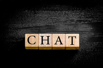 Word CHAT isolated on black background with copy space