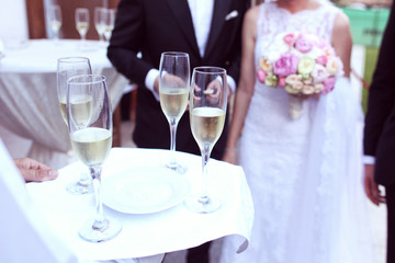 Waiter with glasses of champagne
