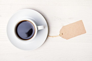 Obraz na płótnie Canvas cup of coffee on white wood table