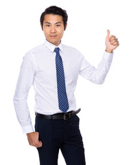 Young Asian man showing thumb up