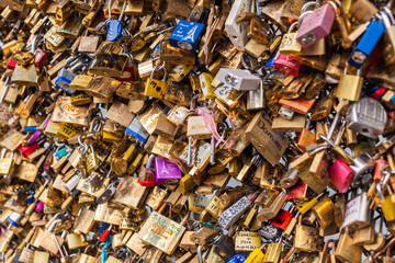 Lots of Padlocks at River Seine, Paris France, symbolizing Love