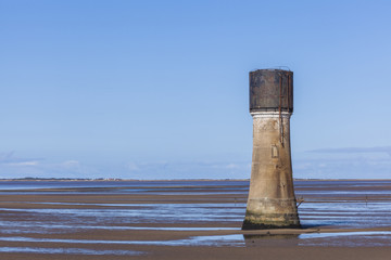 Concrete tower construction on Spurn Point Beach UK