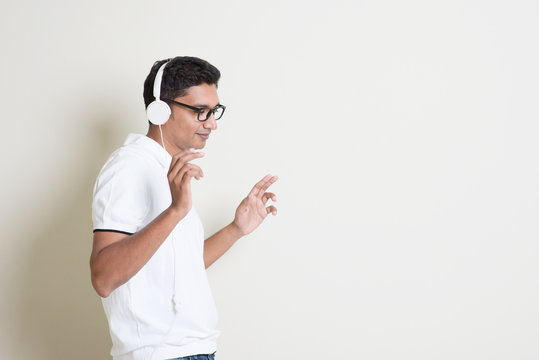 Indian Guy Enjoying Music And Dancing