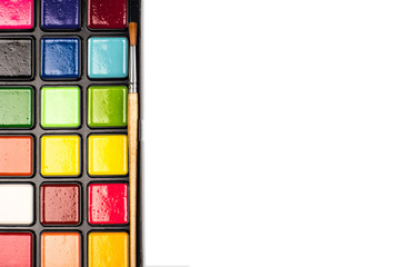 Aquarelle colors in a plastic box isolated on a white background