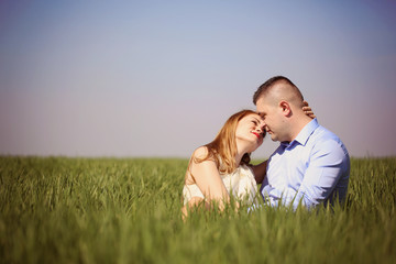 Affectionate couple sitting on grass