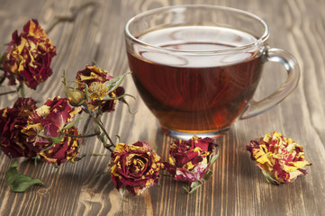 Cup of tea and dry roses