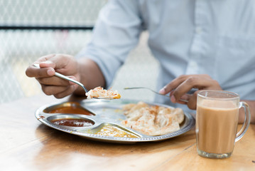 Fototapeta na wymiar Man having Indian meal
