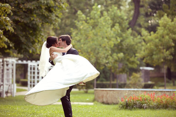 Lovely bride and groom in the park