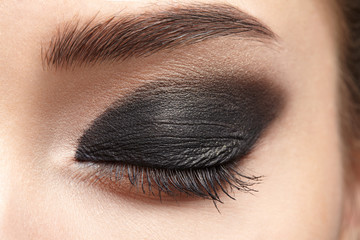 Closeup of beautiful woman eye with makeup, eyeliner