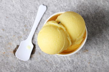passion fruit sorbet in white cup,top view - obrazy, fototapety, plakaty
