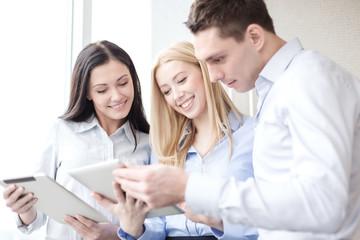 business team working with tablet pcs in office