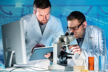 Group of scientists working at the laboratory