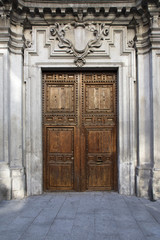 Old door in majestic building entrance