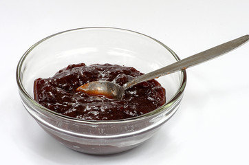 Plum jam in a bowl isolated