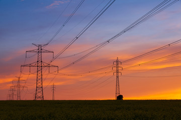 Fototapeta premium Silhouette of high voltage electrical pole structure