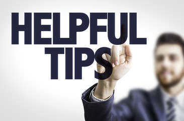 Business man pointing the text: Helpful Tips