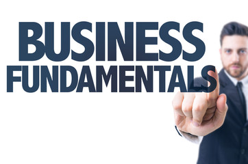 Business man pointing the text: Business Fundamentals
