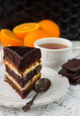 Delicious chocolate cake with cream and fruit