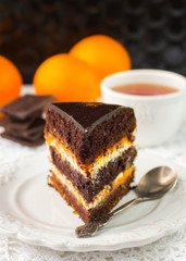 Delicious chocolate cake with cream and fruit