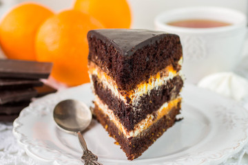 Delicious chocolate cake with cream and fruit