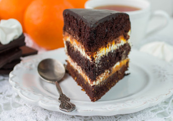 Delicious chocolate cake with cream and fruit