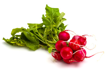 Bunch of fresh red radishes isolated on white background