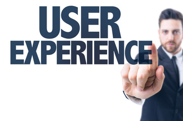 Business man pointing the text: User Experience