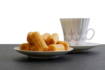 Waffer rolls and cup of coffee