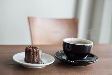 brown sweet canele and hot tea